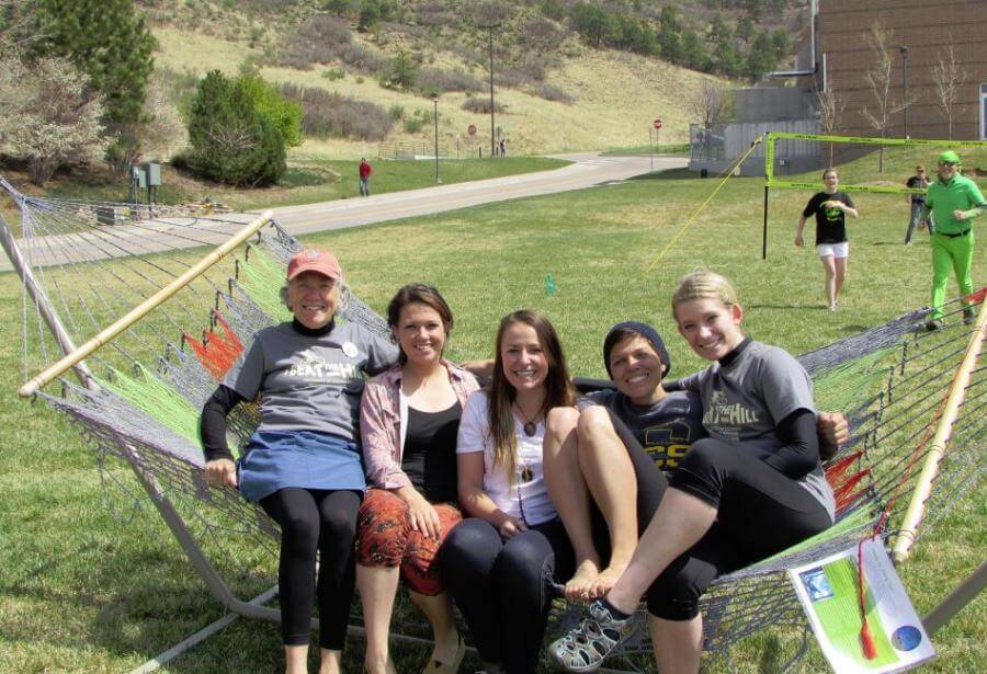 Students and faculty enjoying the hammocks at an Earth Day event