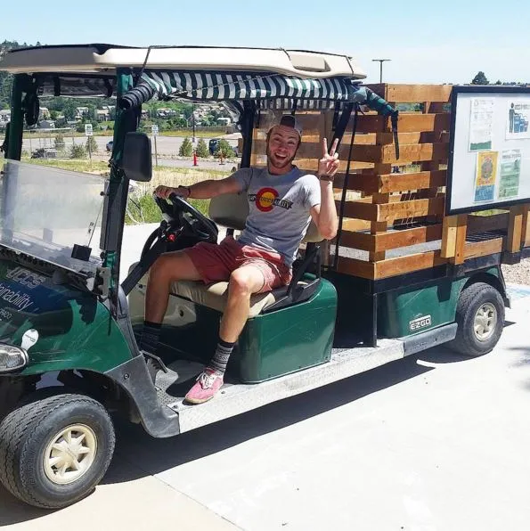 Student driving the electric cart