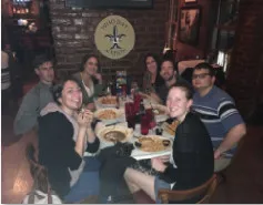 People sitting around a table in a restaurant.
