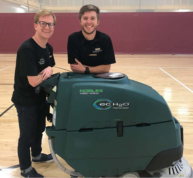 students with floor scrubber